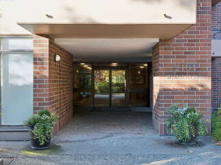 Welcome to 2101 McMullen Ave, a charming property featuring a welcoming entrance with double glass doors.