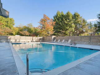 Enjoy a refreshing dip in this stunning outdoor swimming pool, perfect for relaxation and recreation.