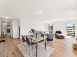 Experience modern living in this beautifully appointed apartment, featuring a spacious open-concept living and dining area perfect for entertaining.