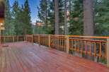 Step onto this expansive wooden deck, perfect for enjoying the serene mountain views.