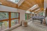 Enjoy indoor recreation in this spacious game room featuring a professional JOOLA ping pong table.