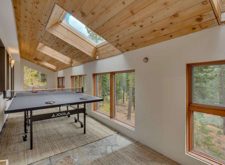 Enjoy indoor fun year-round in this spacious game room, complete with a professional JOOLA ping pong table.