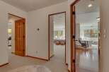 Step into a beautifully appointed hallway that offers glimpses into multiple inviting spaces.