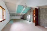 This unfinished attic space presents a blank canvas for your dream home.