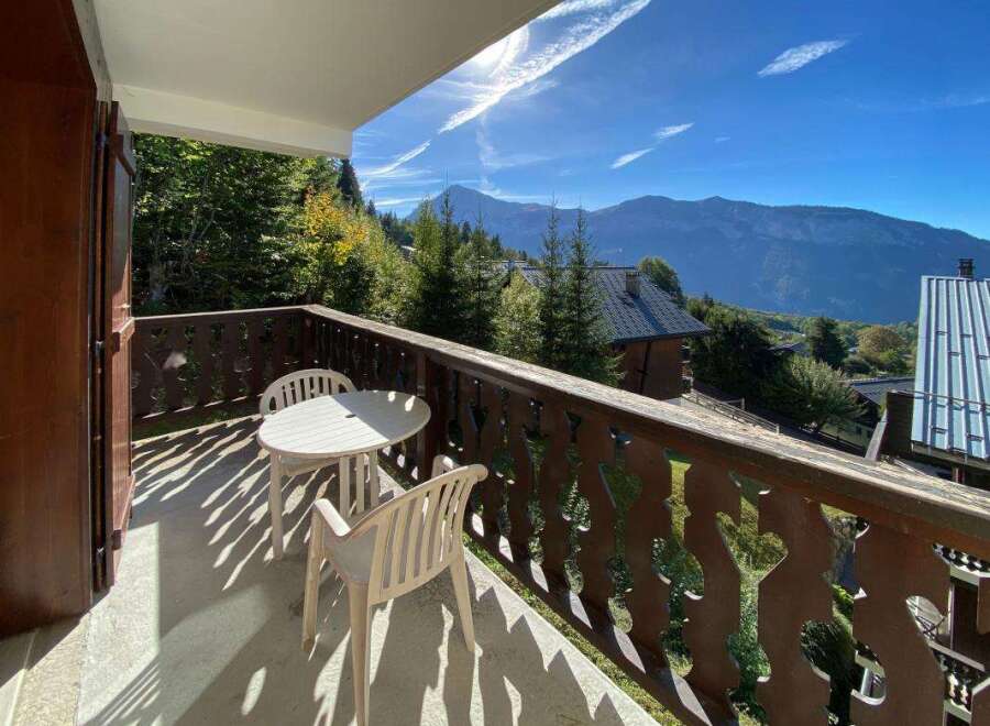 Enjoy breathtaking mountain views from this charming balcony, perfect for your morning coffee or evening relaxation.