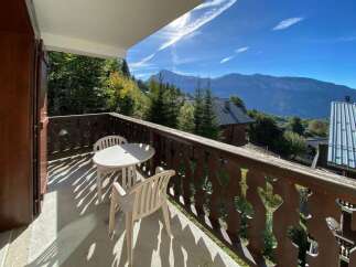 Enjoy breathtaking mountain views from this charming balcony, perfect for your morning coffee or evening relaxation.