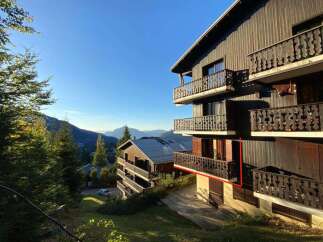 Experience breathtaking mountain views from the multiple balconies of this charming wooden chalet.