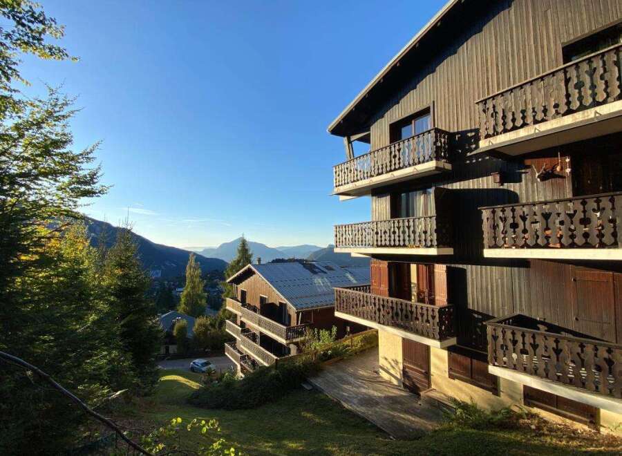 Experience breathtaking mountain views from the multiple balconies of this charming wooden chalet.
