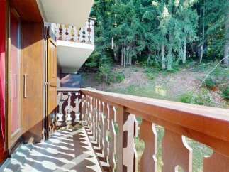 Enjoy the serene mountain views from this charming balcony, perfect for your morning coffee or evening relaxation.