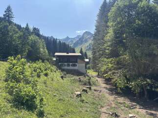 Discover this charming mountain property nestled amidst lush greenery and breathtaking alpine scenery.
