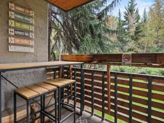 Enjoy the mountain lifestyle with this charming balcony, perfect for relaxing after a day on the slopes.