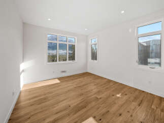 Experience breathtaking mountain views from this spacious room, featuring large windows that flood the space with natural light.