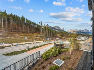 Experience breathtaking mountain views from this stunning property, nestled against a backdrop of majestic peaks and lush pine forests.