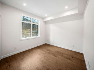 Step into this bright and airy room, featuring rich hardwood floors that add warmth and elegance.