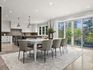 Experience elegant open-concept living in this stunning kitchen and dining area, perfect for entertaining.