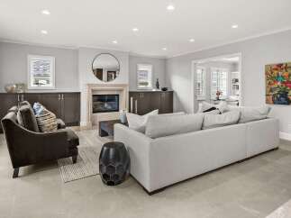 Step into this inviting living room, featuring a cozy fireplace as the focal point, perfect for gathering with loved ones.