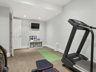 Transform your home into a personal fitness sanctuary with this dedicated workout space.