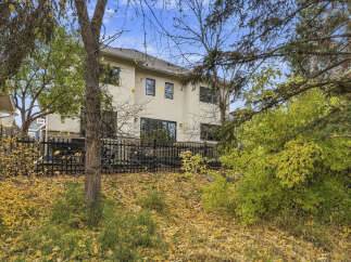 Experience the charm of autumn with this stunning property, featuring a spacious backyard perfect for enjoying the changing seasons.
