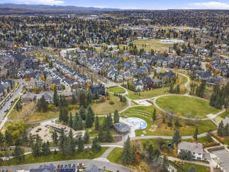 Experience the charm of this picturesque suburban neighborhood, featuring a variety of modern homes with elegant architectural details and dark roofs.