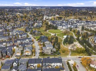 Experience luxury living in this stunning aerial view of a modern suburban neighborhood.