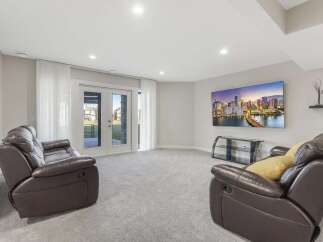 Step into this inviting finished basement, perfect for entertainment and relaxation.