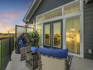 Enjoy outdoor living on this spacious balcony, perfect for entertaining or relaxing.