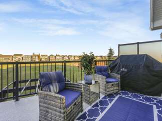Enjoy outdoor living on this spacious deck, perfect for entertaining or relaxing.