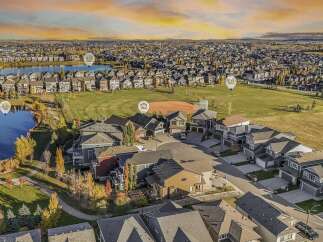 Experience luxury living in this stunning aerial view of a suburban neighborhood.