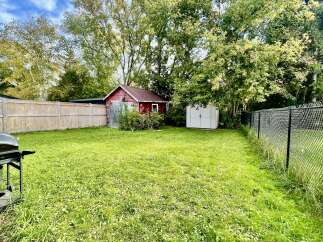 Discover this charming backyard oasis, perfect for outdoor living and entertaining.