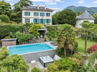 Experience luxurious living in this stunning property featuring a pristine swimming pool and a relaxing hot tub, perfect for unwinding.