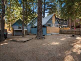 Discover this charming property nestled among mature pine trees, offering a serene and private atmosphere.
