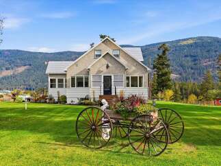 Charming home nestled amidst rolling hills and lush greenery, offering a serene countryside living experience.