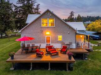 Enjoy outdoor living at its finest on this expansive wooden deck, perfect for entertaining or relaxing.