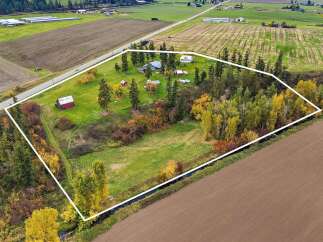 Discover this expansive rural property, perfect for those seeking tranquility and space.