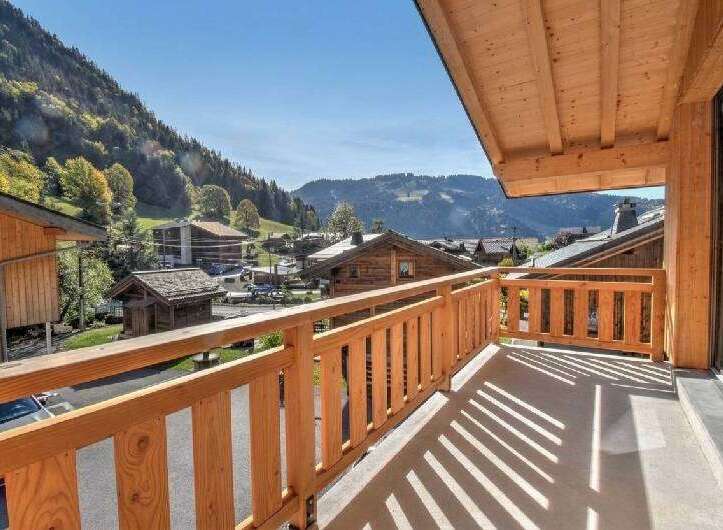 Enjoy breathtaking mountain views from this charming wooden balcony, perfect for your morning coffee or evening relaxation.