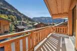 Enjoy breathtaking mountain views from this charming wooden balcony, perfect for your morning coffee or evening relaxation.