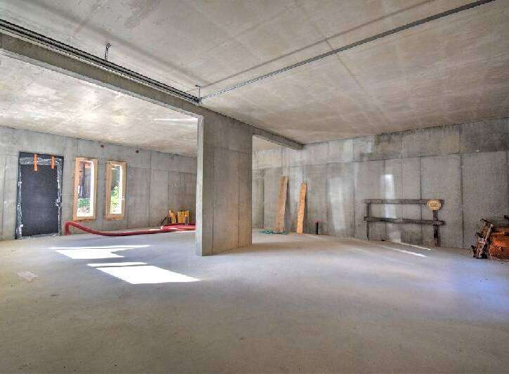 Discover the potential of this unfinished concrete space, perfect for customization and development.