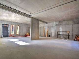 Discover the potential of this unfinished concrete space, perfect for customization and development.