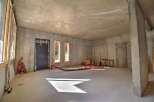 Discover this unfinished concrete space, perfect for customization and renovation.
