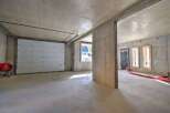 Discover the potential of this unfinished concrete space, perfect for a workshop or storage.
