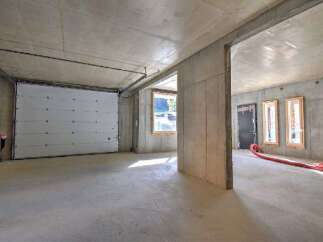 Discover the potential of this unfinished concrete space, perfect for a workshop or storage.