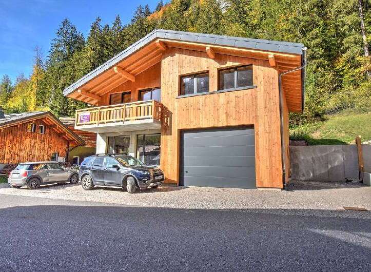 Experience luxury mountain living in this stunning wooden chalet, featuring a modern design and ample natural light.