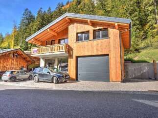 Experience luxury mountain living in this stunning wooden chalet, featuring a modern design and ample natural light.
