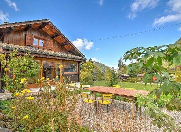 Experience the charm of this rustic wooden chalet nestled amidst a serene mountain landscape.