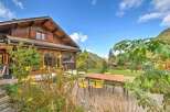 Experience the charm of this rustic wooden chalet nestled amidst a serene mountain landscape.