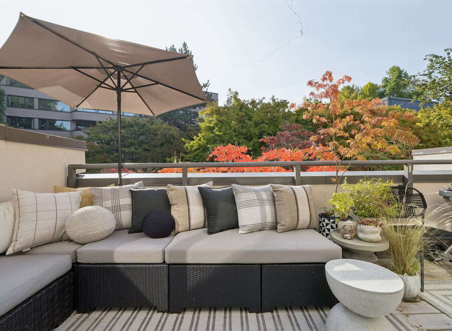 Enjoy outdoor living on this spacious balcony, perfect for entertaining or relaxing.