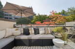 Enjoy outdoor living on this spacious balcony, perfect for entertaining or relaxing.