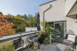 Enjoy outdoor living on this spacious balcony, perfect for entertaining or relaxing.