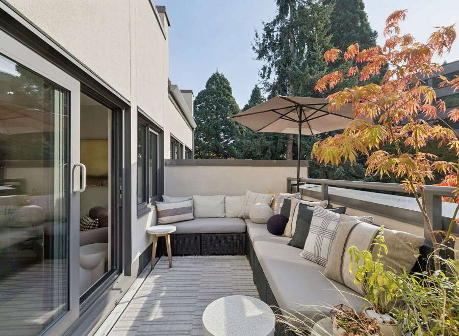 Enjoy outdoor living on this spacious balcony, perfect for entertaining or relaxing.