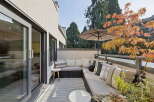 Enjoy outdoor living on this spacious balcony, perfect for entertaining or relaxing.